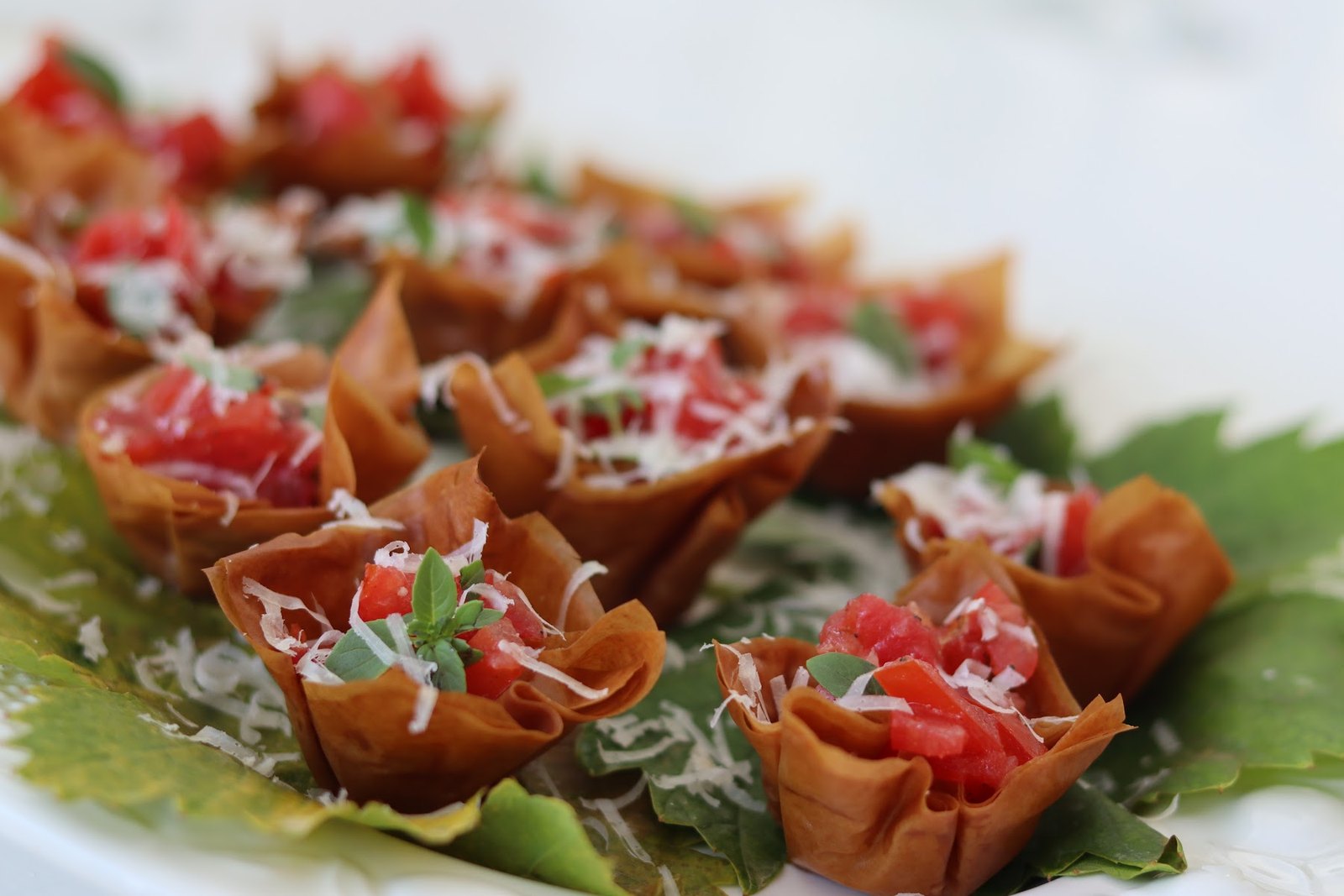 Colourful starter cups with tomato and herbs