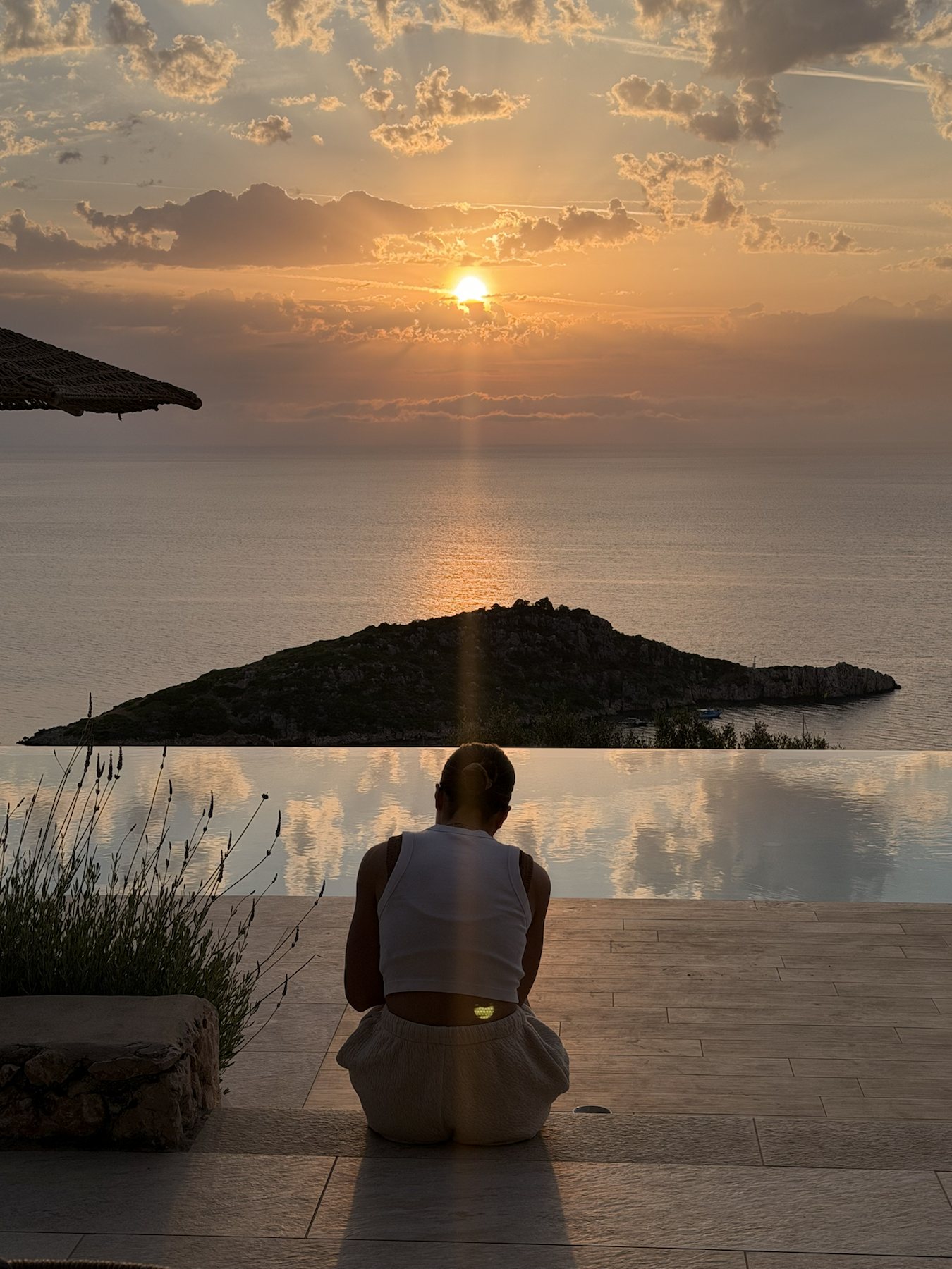 A quiet sunset moment by the villa pool