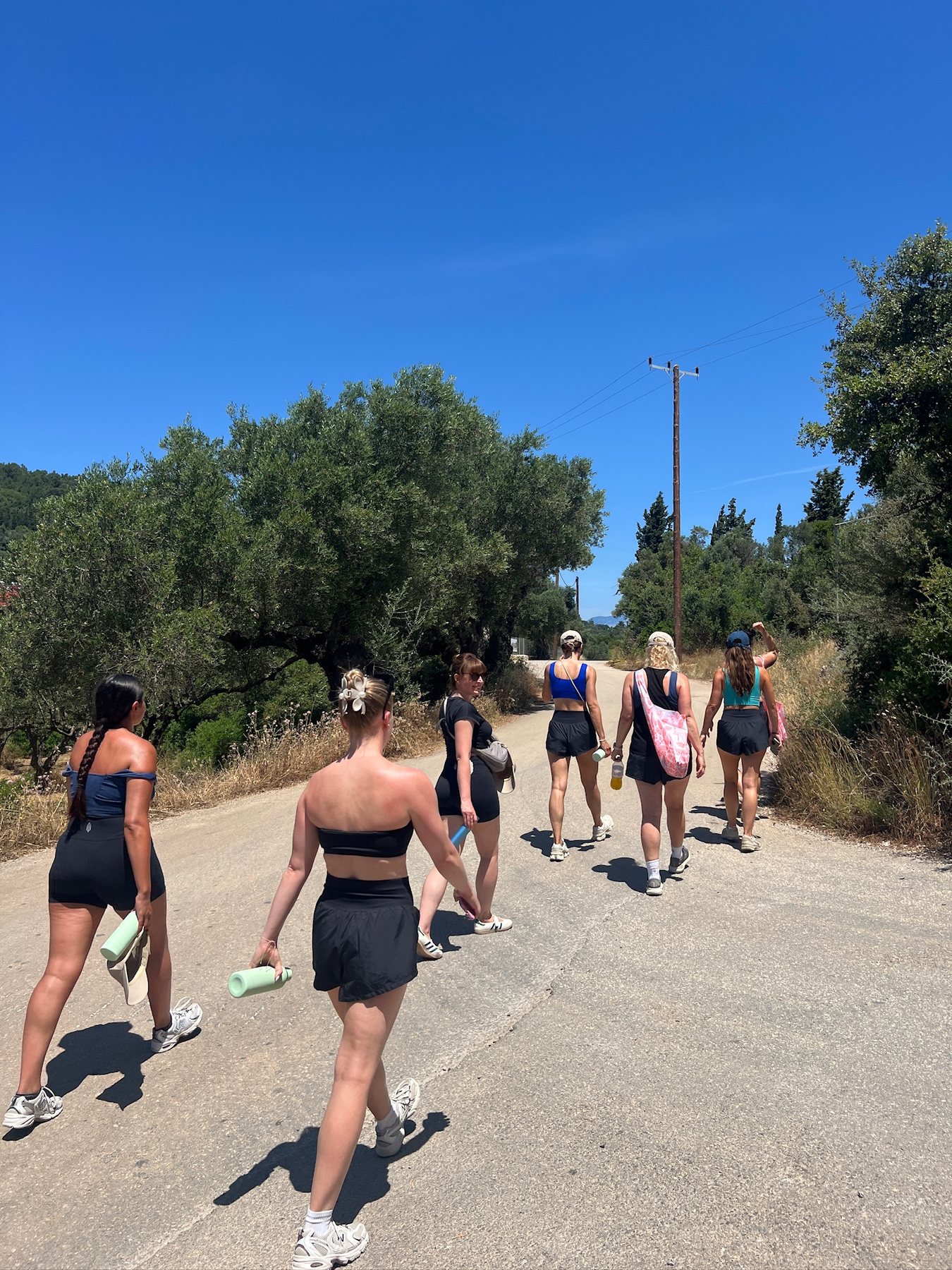 Guests walking together under the blue Zakynthos sky