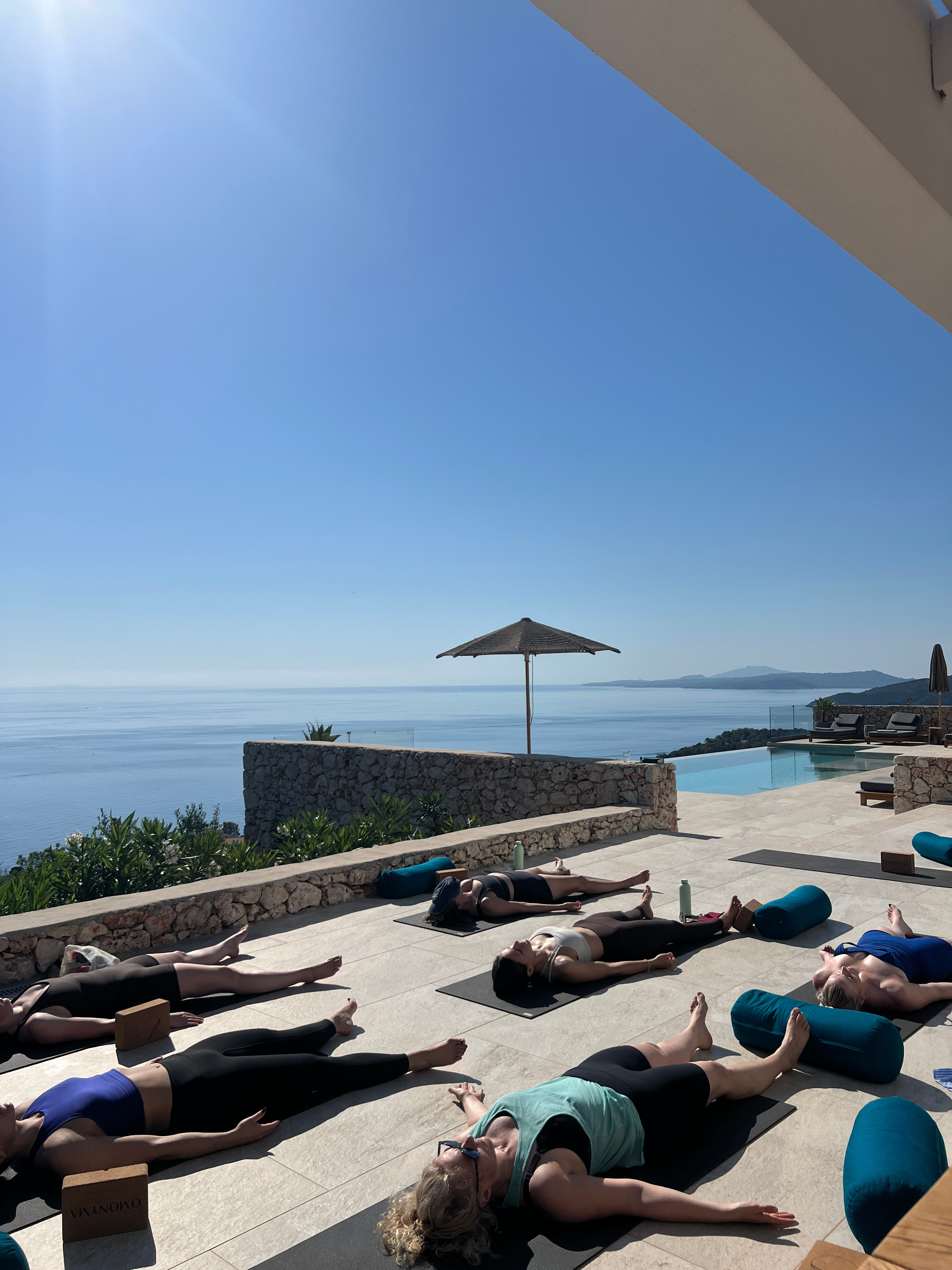 Restorative yoga practice on the sea-view terrace